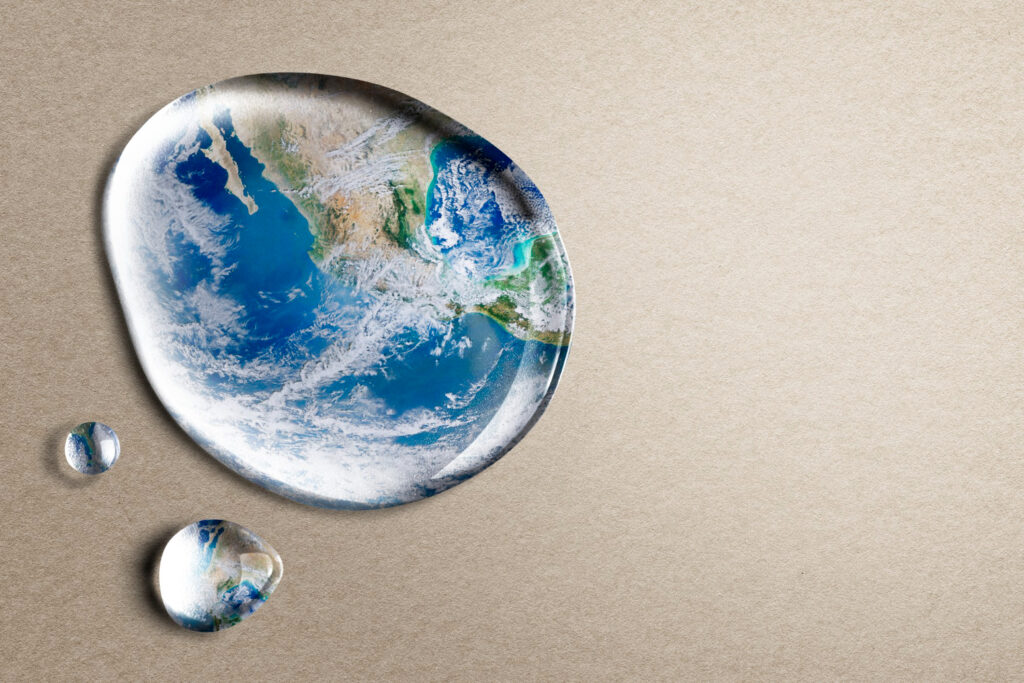 Water droplets reflecting the Earth, symbolizing the global environmental impact of effective methane leak detection and repair.