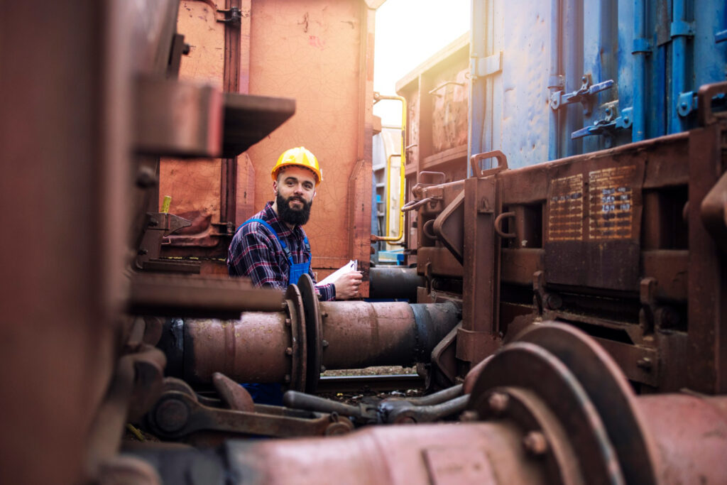 An industrial worker in safety gear performing a site inspection as part of a methane leak detection and repair program.